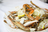 Plate of crabs with lemon wedges